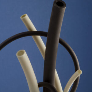 Black and natural Suprene tubing on a dark blue background